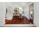 Cozy dining area with hardwood floors, modern light fixture, and views of the backyard at 5042 Southland Dr, Woodstock, GA 30188
