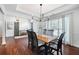 Cozy dining area with a wooden table, stylish chairs, and natural light from a window at 5042 Southland Dr, Woodstock, GA 30188