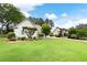 Charming home featuring a lush front yard with well-manicured landscaping and a welcoming driveway at 5042 Southland Dr, Woodstock, GA 30188