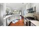Bright kitchen featuring stainless appliances, hardwood floors, and white cabinets at 5042 Southland Dr, Woodstock, GA 30188