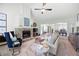 Cozy living room featuring a stone fireplace, comfortable seating, and an open layout at 5042 Southland Dr, Woodstock, GA 30188