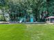 Community playground with green and blue equipment for hours of fun and active play at 5042 Southland Dr, Woodstock, GA 30188