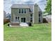 Large backyard with patio seating, a green lawn, and well-maintained landscaping at 6030 Pattingham Dr, Roswell, GA 30075