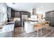Modern kitchen with gray cabinetry, granite countertops, stainless steel appliances, and a central island at 6030 Pattingham Dr, Roswell, GA 30075