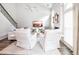 Bright and airy living room with a fireplace, tall windows, and stylish neutral furniture at 6030 Pattingham Dr, Roswell, GA 30075