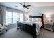 Relaxing primary bedroom with large bed, soft lighting, and a view out the window at 6030 Pattingham Dr, Roswell, GA 30075