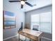 Home office with modern desk, chair, and a large window providing ample natural light at 6030 Pattingham Dr, Roswell, GA 30075