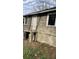 Back of house featuring access door, small porch, and a foundation in need of repair at 1131 Indale Sw Pl, Atlanta, GA 30310