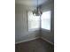 Cozy dining nook with wainscotting, new flooring, and natural light from two windows at 1131 Indale Sw Pl, Atlanta, GA 30310