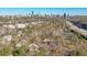 Aerial view of community with mature trees, buildings, and Atlanta skyline at 1418 Summit North Ne Dr # 1418, Atlanta, GA 30324