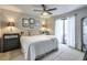 Bright bedroom with ceiling fan, neutral decor, and access to outdoor patio at 1418 Summit North Ne Dr # 1418, Atlanta, GA 30324