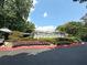 Clubhouse with covered parking surrounded by manicured landscaping at 1418 Summit North Ne Dr # 1418, Atlanta, GA 30324
