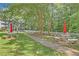 Landscaped gardens with walking path, stone benches, and white picket fence at 1418 Summit North Ne Dr # 1418, Atlanta, GA 30324