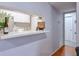 Pass through kitchen featuring stainless steel sink and white cabinets at 1418 Summit North Ne Dr # 1418, Atlanta, GA 30324