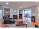 Cozy living room with fireplace, hardwood floors, and adjacent workspace at 1418 Summit North Ne Dr # 1418, Atlanta, GA 30324