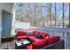 Relaxing covered patio with comfortable seating and views of surrounding trees at 1418 Summit North Ne Dr # 1418, Atlanta, GA 30324