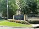 Welcome to Piedmont Heights Condominiums sign with flowers at 1418 Summit North Ne Dr # 1418, Atlanta, GA 30324