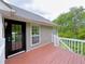 Exterior view of the wood deck and glass paned door, perfect for outdoor living at 3342 Windpointe Ct, Buford, GA 30519