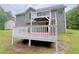 Spacious back deck featuring white wooden railings, perfect for entertaining and outdoor relaxation at 3342 Windpointe Ct, Buford, GA 30519