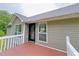 Exterior view of the wood deck and glass paned door, perfect for outdoor living at 3342 Windpointe Ct, Buford, GA 30519