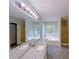 Bright bathroom features a double granite vanity, soaking tub and separate shower at 3342 Windpointe Ct, Buford, GA 30519
