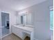 Double granite vanity features bright lighting and ample storage space at 3342 Windpointe Ct, Buford, GA 30519