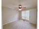 Neutral bedroom with plush carpet, ceiling fan and bright natural light at 3342 Windpointe Ct, Buford, GA 30519