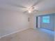 Spacious carpeted bedroom with neutral walls and natural light from a window at 3342 Windpointe Ct, Buford, GA 30519
