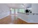 Inviting kitchen and dining area featuring hardwood floors, stainless steel appliances, and natural light at 3342 Windpointe Ct, Buford, GA 30519
