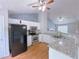 Well-equipped kitchen with stainless steel appliances, granite countertops, and ample cabinet space at 3342 Windpointe Ct, Buford, GA 30519