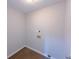 Functional laundry area with hardwood style flooring and hookups at 3342 Windpointe Ct, Buford, GA 30519