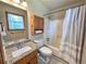 The bathroom is fitted with a granite vanity and a shower-tub combo at 3814 Lamar Way, Snellville, GA 30039