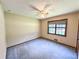 This bedroom offers neutral walls, soft carpet, and a bright window for natural light at 3814 Lamar Way, Snellville, GA 30039