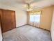 This bedroom offers carpet, neutral walls, and ample closet space at 3814 Lamar Way, Snellville, GA 30039