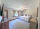 Cozy bedroom features a ceiling fan, neutral paint, and a comfortable bed at 3814 Lamar Way, Snellville, GA 30039