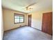 This bedroom features carpet, neutral walls, and ample closet space at 3814 Lamar Way, Snellville, GA 30039