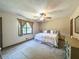 Comfortable bedroom featuring carpet, ceiling fan, natural light, and neutral paint at 3814 Lamar Way, Snellville, GA 30039