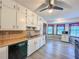 Bright eat-in kitchen with white cabinets, wood countertops, modern gray flooring and bright natural light at 3814 Lamar Way, Snellville, GA 30039