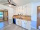 Kitchen featuring wood floors, white cabinets, stainless steel sink, and stainless steel appliances at 3814 Lamar Way, Snellville, GA 30039