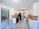 Bright kitchen with white cabinets, black appliances, wood countertop and gray flooring provides ample space at 3814 Lamar Way, Snellville, GA 30039