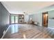 Bright open living room with light gray walls, modern flooring, stone fireplace and lots of natural light at 3814 Lamar Way, Snellville, GA 30039