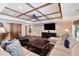 This finished basement features a large sectional sofa and coffered ceiling at 5475 Copper Creek Pass, Cumming, GA 30040