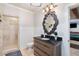 This bathroom features a walk-in shower and a decorative mirror at 5475 Copper Creek Pass, Cumming, GA 30040