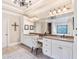 Bathroom with dual vanities, granite countertops, and decorative lighting at 5475 Copper Creek Pass, Cumming, GA 30040