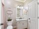 Half bathroom with decorative wall hangings and a new toilet at 5475 Copper Creek Pass, Cumming, GA 30040