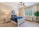 Comfortable bedroom featuring a ceiling fan, dresser, and bedside tables at 5475 Copper Creek Pass, Cumming, GA 30040