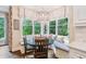 Cozy breakfast nook with built-in bench seating and bay window, filled with natural light at 5475 Copper Creek Pass, Cumming, GA 30040