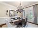 Charming dining room with stylish chandelier, modern decor, and a bright, airy atmosphere at 5475 Copper Creek Pass, Cumming, GA 30040