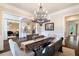 Open concept dining room with views to the adjacent living spaces, featuring stylish décor and a large dining table at 5475 Copper Creek Pass, Cumming, GA 30040