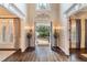 Beautiful foyer entrance featuring rich hardwood floors and lovely natural light at 5475 Copper Creek Pass, Cumming, GA 30040